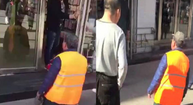 环卫工在5元店门前一跪不起 店主生拉硬拽